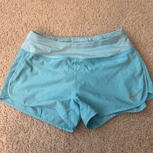 Light blue Nike Dri Fit running shorts